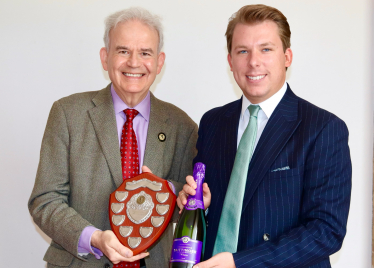 Julian receiving Chairman’s Award from James.